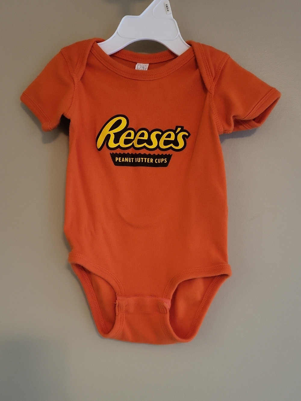 Orange Reese's Peanut Butter Cups onesie/bodysuit